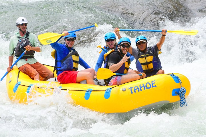 a group of people riding on the back of a boat