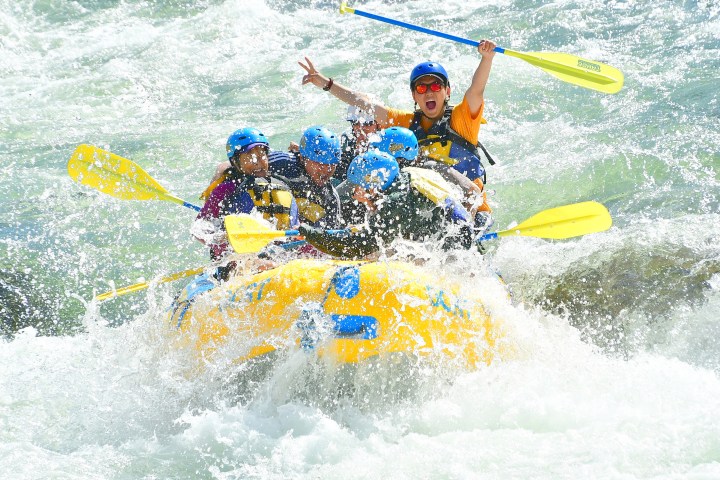 a man riding a wave on a surfboard in the water