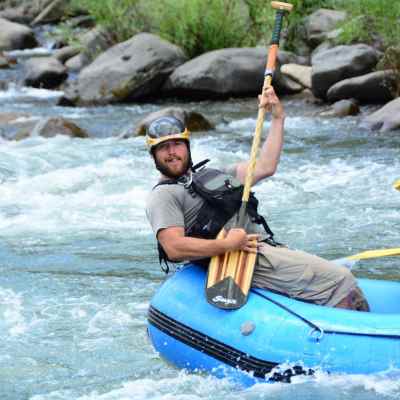 a group of people on a raft in the water