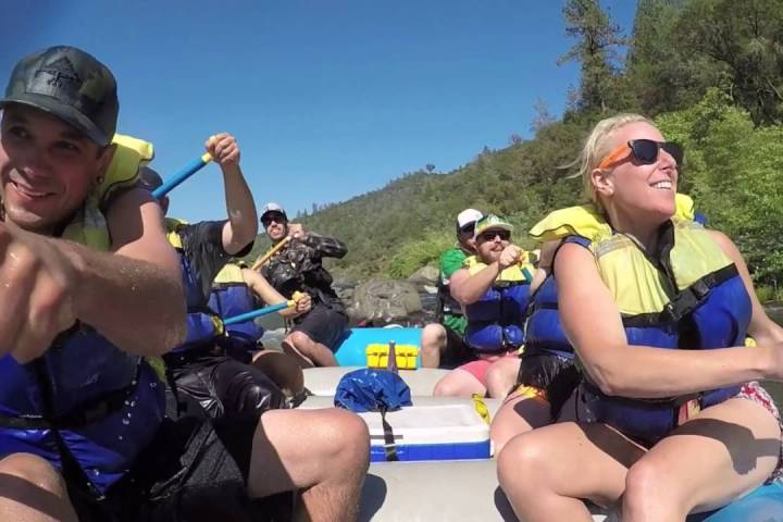 a group of people sitting on a bench
