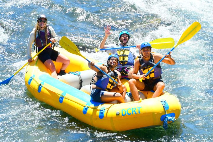 a group of people on a raft in the water