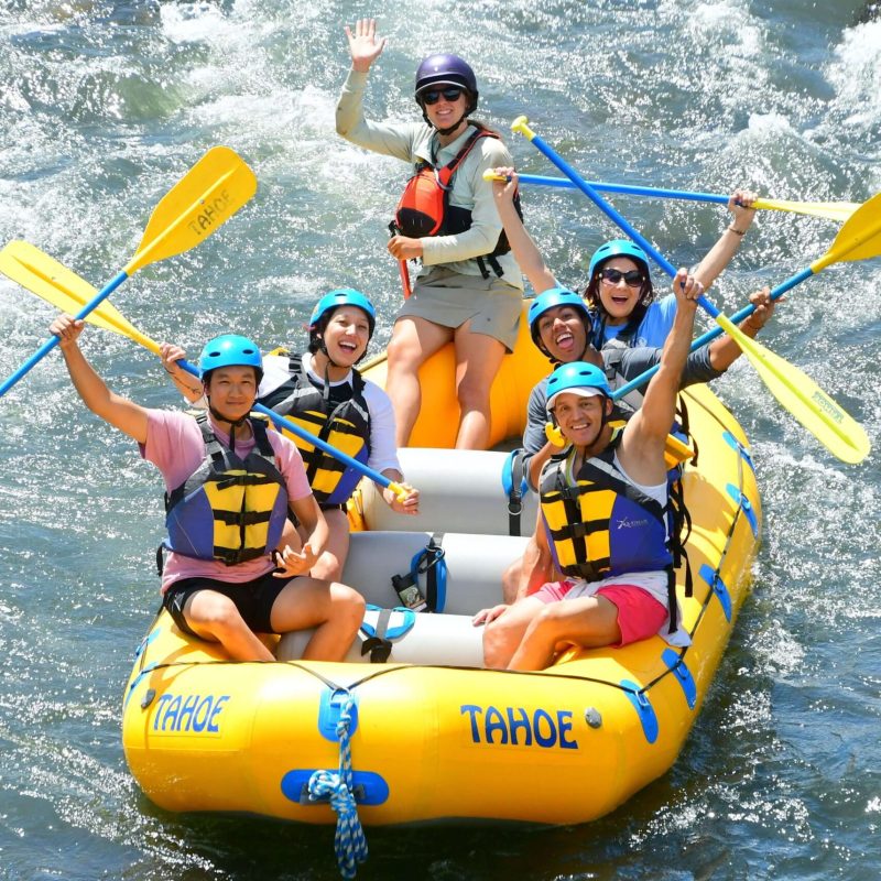 a group of people on a raft in the water