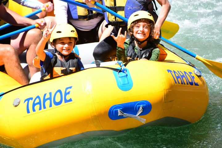a small child sitting on a boat