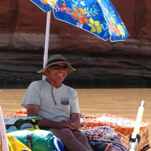 a man holding a colorful umbrella