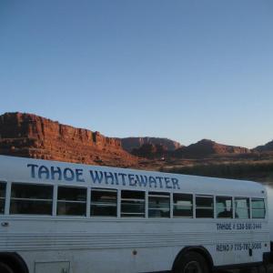 a bus parked in front of a mountain