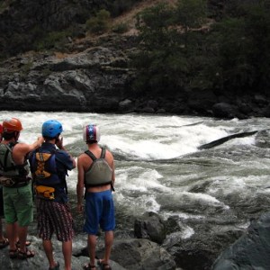 a group of people standing on a rock