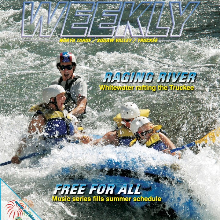 a group of people riding skis on a raft