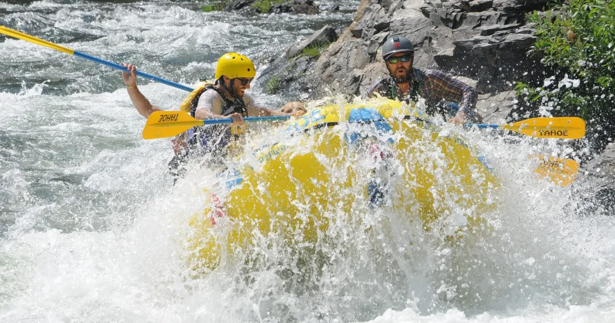 Half-Day-Beginner-Whitewater-South-Fork-American-River-Gorge-Run-Class-III-Whitewater-image-1 a man riding a wave on a surfboard in the water