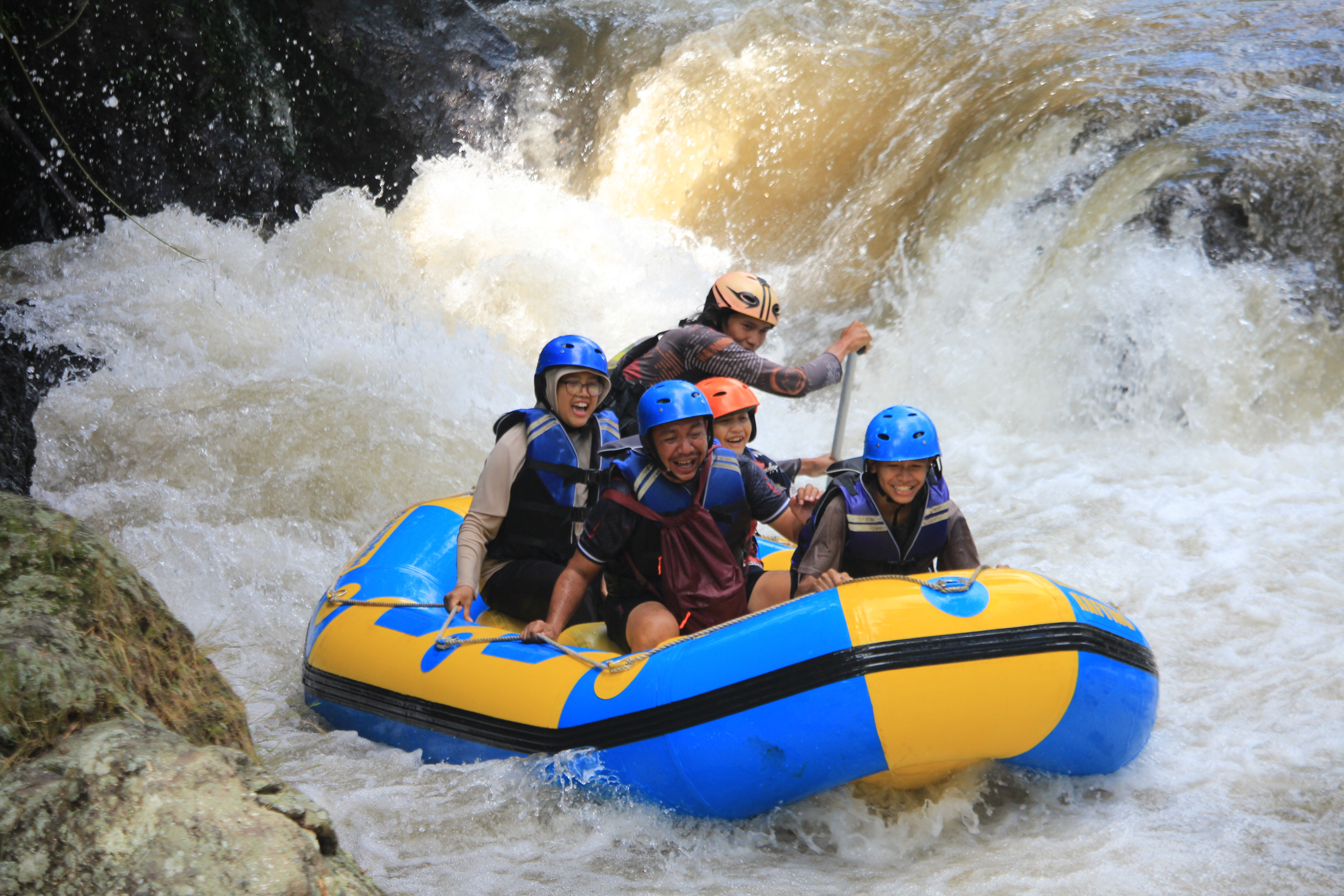 A family of four enjoys whitewater rafting near Truckee with a professional guide.