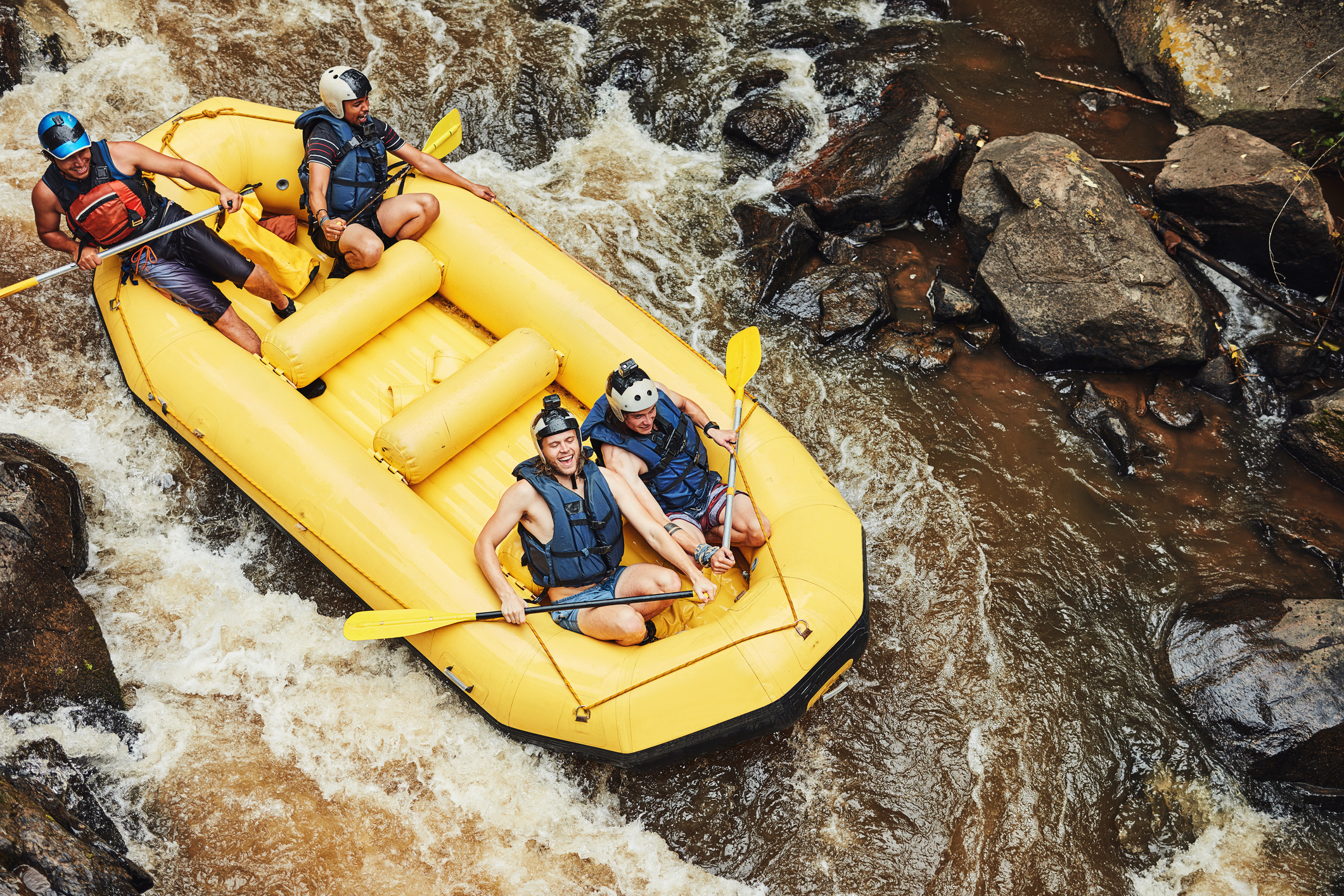 Shot of a group of friends out river rafting on a sunny day near Lake Tahoe.