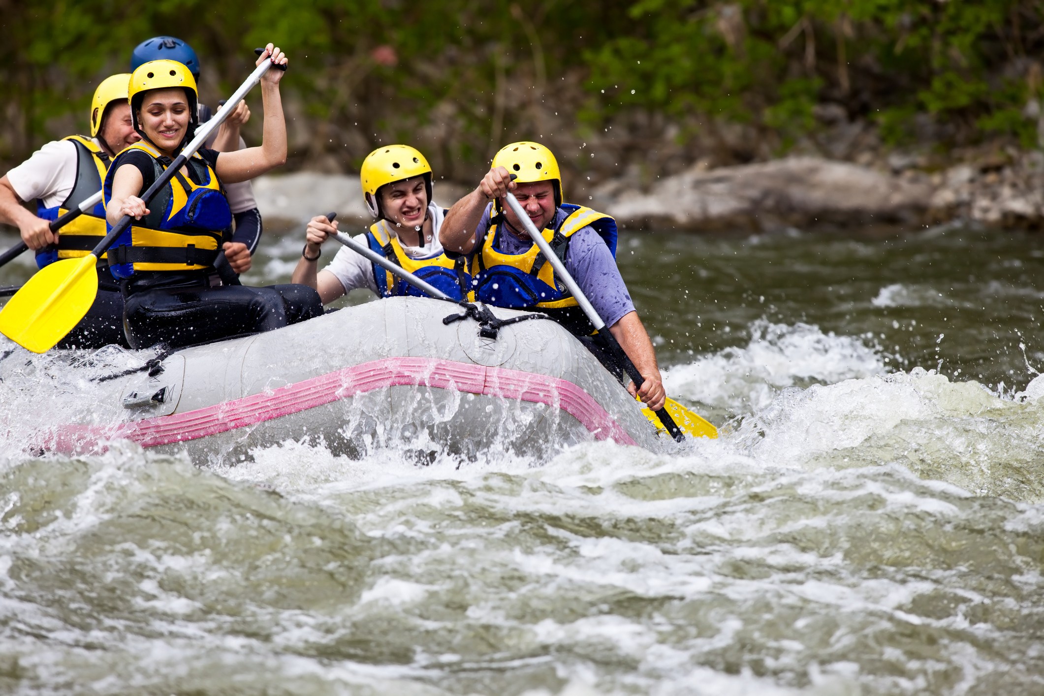 Group of five people whitewater rafting near Lake Tahoe.